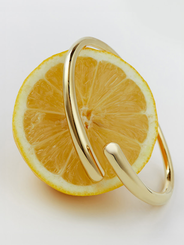 Gold bracelet on a lemon
