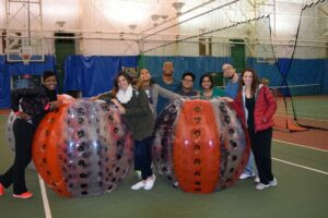 Group of people playing with hamster wheels