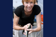 Sara Rademaker smiles while holding an American eel (Courtesy of American Unagi.)