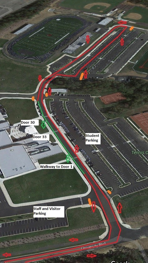 An aerial view of a parking lotDescription automatically generated