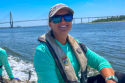 Lindsay French wears a lifejacket on a boat