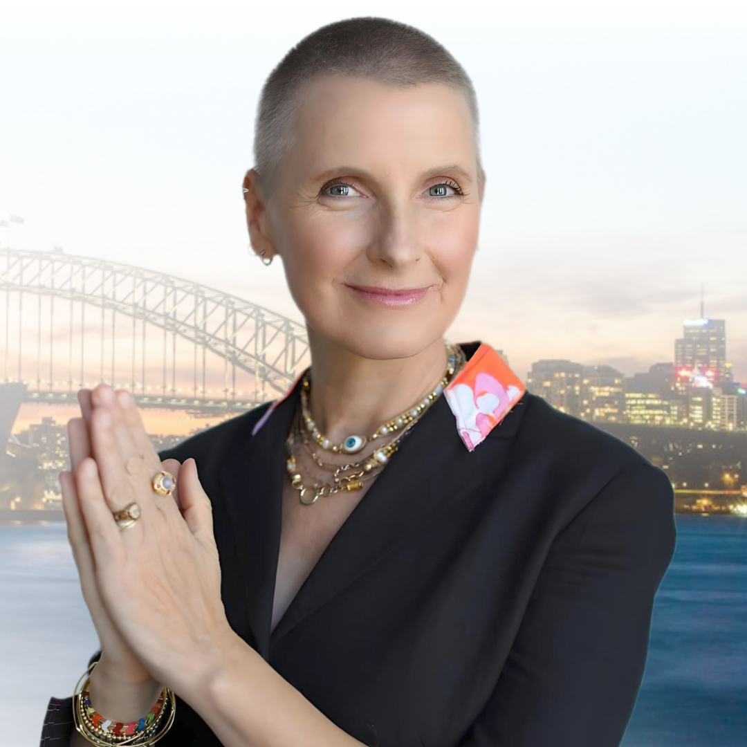 Woman with short hair clasps hands together