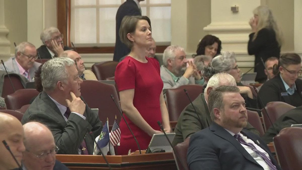 Laurel Libby standing in red dress.