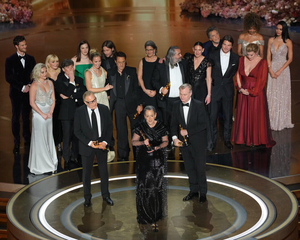 The producers, director and cast of “Oppenheimer” onstage at the Oscars.