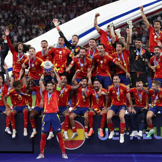 Spain's forward #07 Alvaro Morata holds the trophy after winning the UEFA Euro 2024 final football match between Spain and England at the Olympiastadion in Berlin on July 14, 2024. (Photo by Adrian DENNIS / AFP)