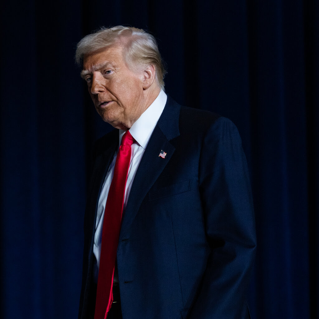 President Donald Trump in a suit and a red tie. 