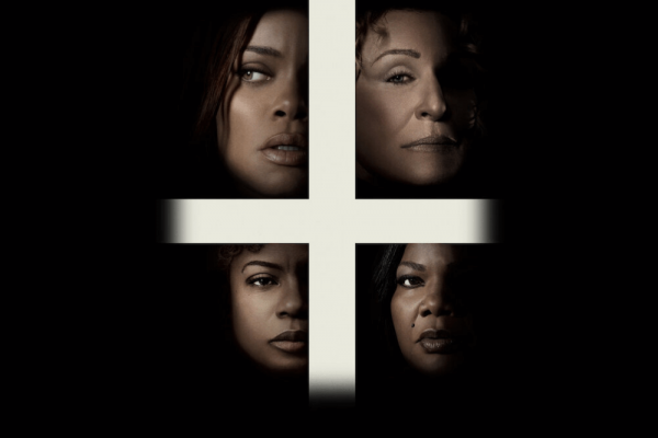 Four faces surround a white cross, surrounded by black.