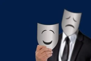 Illustration of person with two masks, one happy and one sad