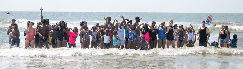 Camp Hope campers in the surf on Folly Beach