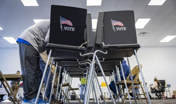 Voters cast their ballots at the Your Vote Center in the Andalucia Shopping Center on Election Day, Tuesday, Nov. 5, 2024, in Albuquerque, N.M. (Gino Gutierrez/The Albuquerque Journal via AP)