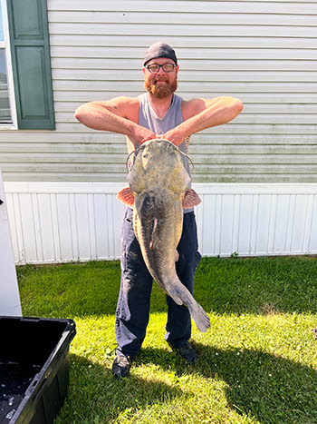 While bowfishing recently in Monroe County, Codie Carlson of Newport, Michigan, caught a new state-record flathead catfish.