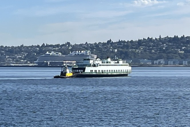 Tugboat pushing a ferry