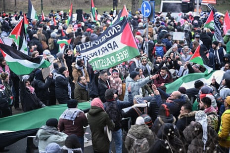 Pro-Palestinian protestors demonstrate holding Palestinian flags and banners in front of the ICJ building in The Hague, the Netherlands.