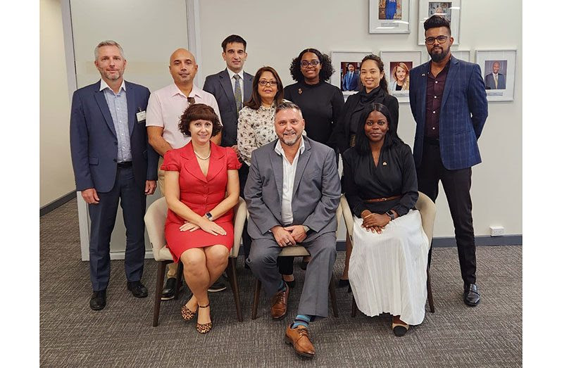 His Excellency, Sébastien Sigouin, High Commissioner of Canada to Guyana (seated centre), flanked by the high-level Canadian delegation