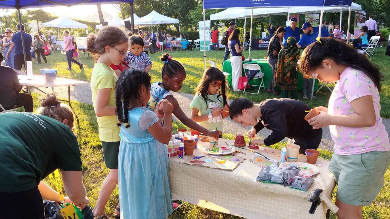 children being crafty at table at power in the park event