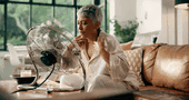 Woman fanning herself