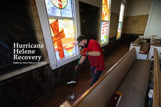 Elias Torres cleans up flood damage from Hurricane Helene at Cedar Key (Fla.) United Methodist Church. Photo by Mike DuBose, UM News.