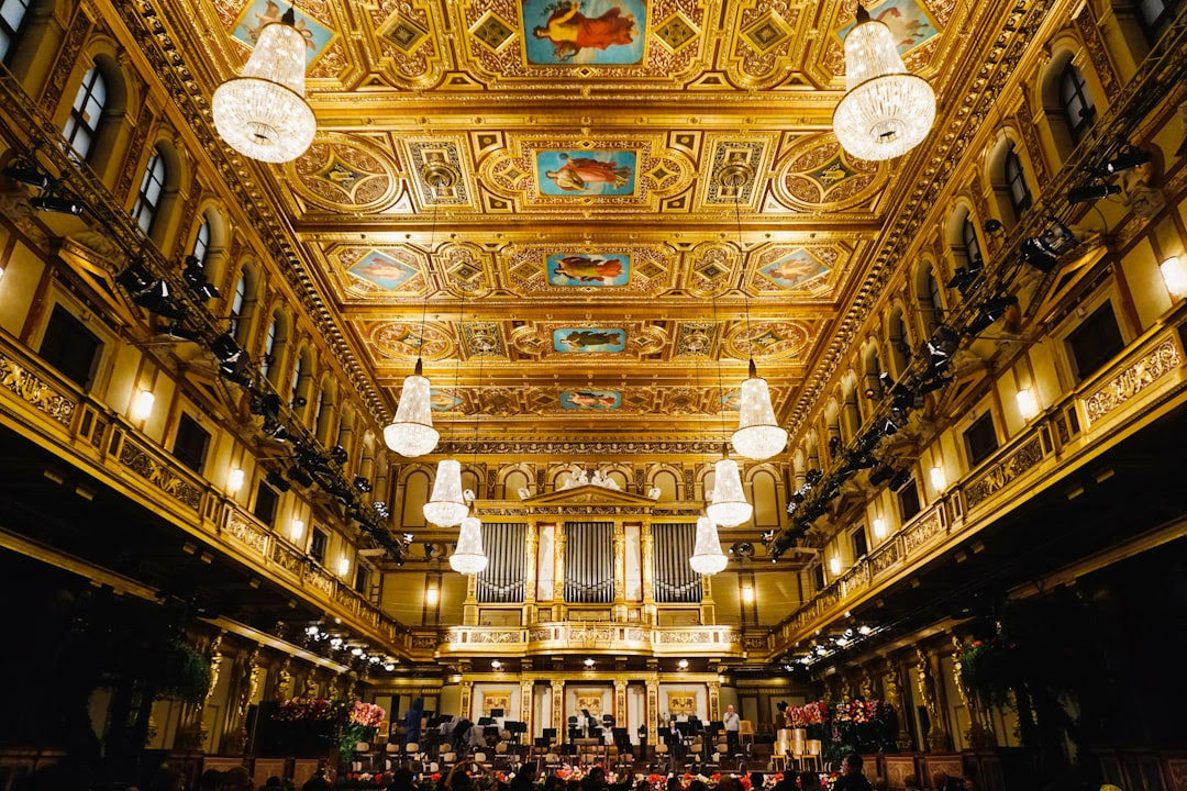 people inside building with chandeliers