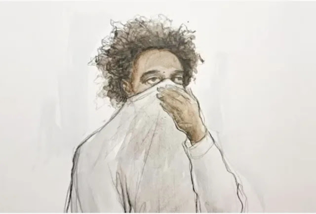 17-year-old Axel Rudakubana (centre) covered his face as he appeared in the dock at Liverpool Crown Court on Thursday. (SWNS)