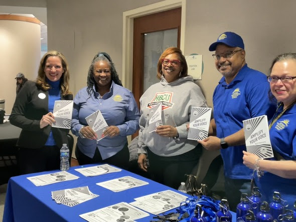 Secretary Benson and a group at Detroit early voting site