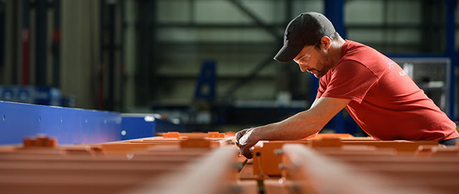 Man in ascent Aerospace working on a machine