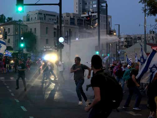 Israeli police use water canon to disperse a protest against Prime Minister Benjamin Netanyahu's government in Jerusalem, on Monday.