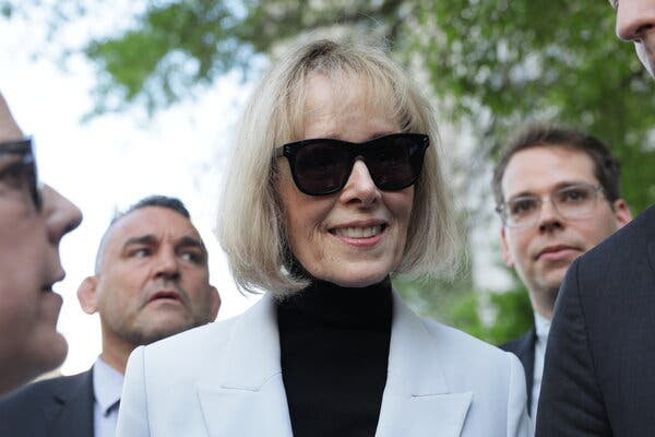 E. Jean Carroll smiles in sunglasses.