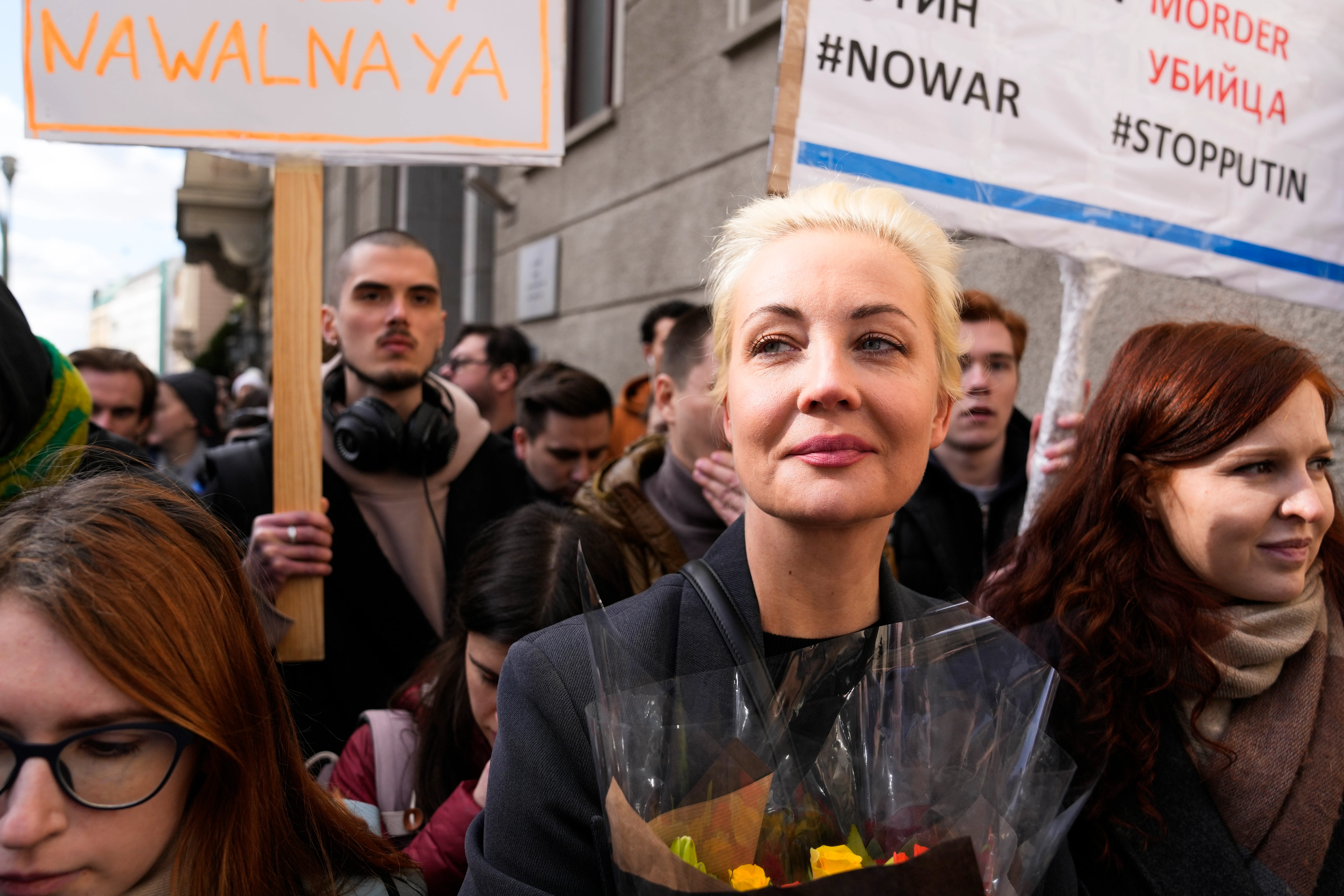 Yulia Navalnaya, center, widow of Alexey Navalny, stands in a queue with other voters at a polling station near the Russian embassy in Berlin in March.