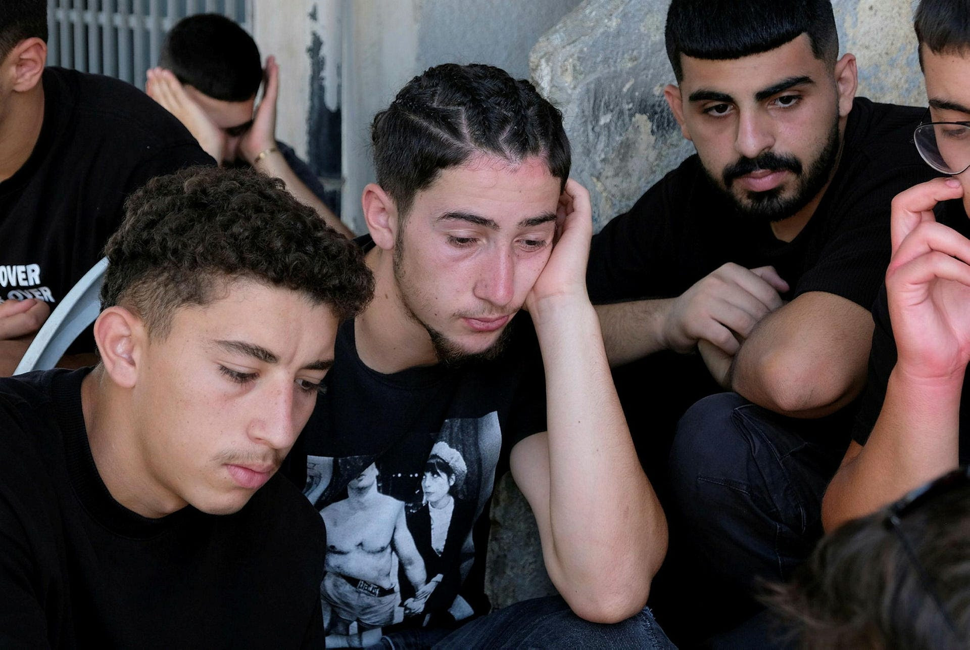 Teenagers mourn the deaths of the 12 children, in Majdal Shams, Sunday.