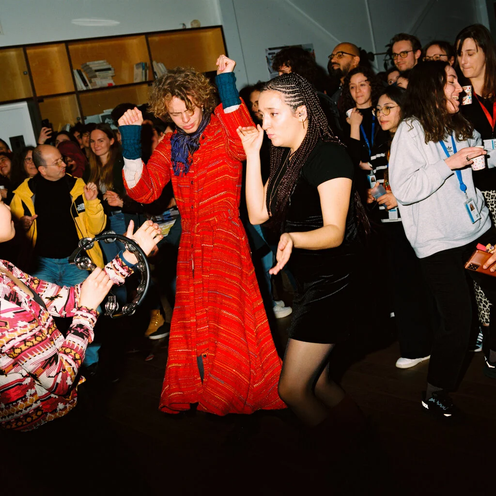 A group of people dancing. 