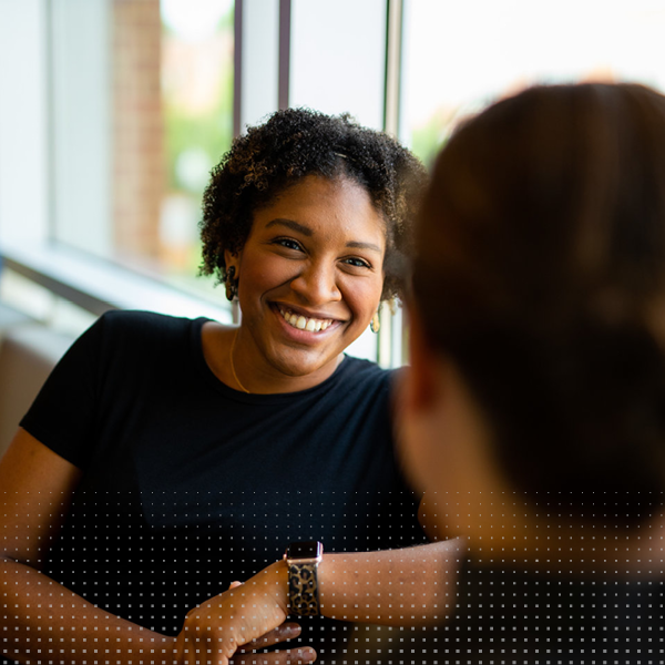 A student talks to an advisor