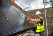 Person installing solar panels