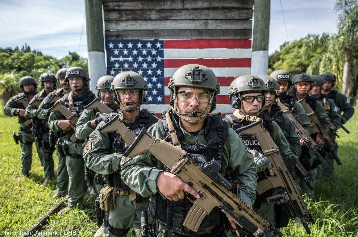 May be an image of 6 people and text that says 'POLICE POLICE DLICE ROLICL Photo: Josh Denmark- DHS'