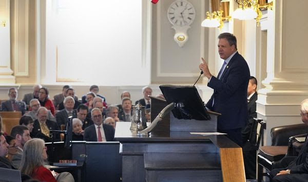 New Hampshire Governor Chris Sununu gestures during his State of the State address at the State House, Thursday, Feb. 15, 2024, in Concord, N.H. The nation is now split exactly in half over whether biological males should participate in female sports. (AP Photo/Charles Krupa)