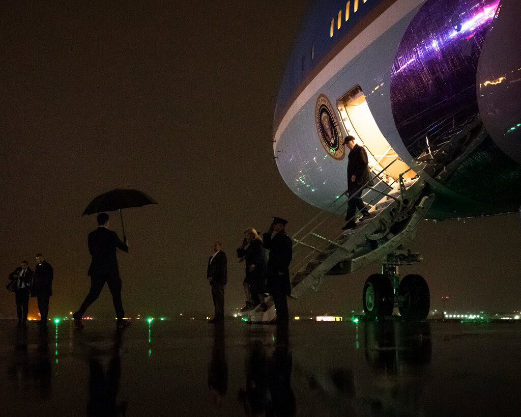 President Biden getting off Air Force One at night.