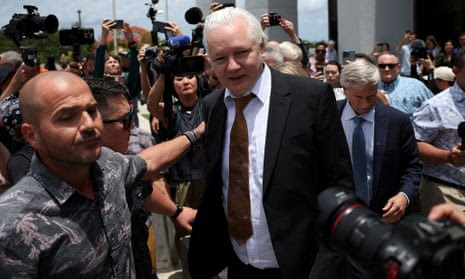 WikiLeaks founder Julian Assange leaves court in Saipan.