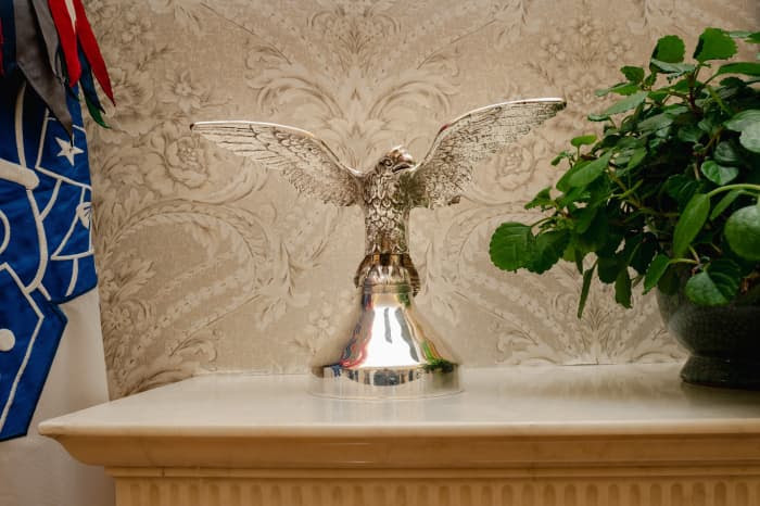 An eagle figure on a mantel in the Oval Office.