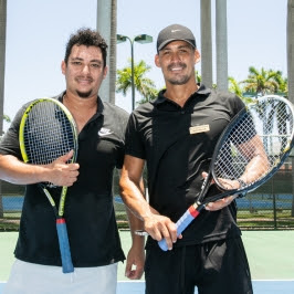 ryan and rayne russell holding tennis racquets