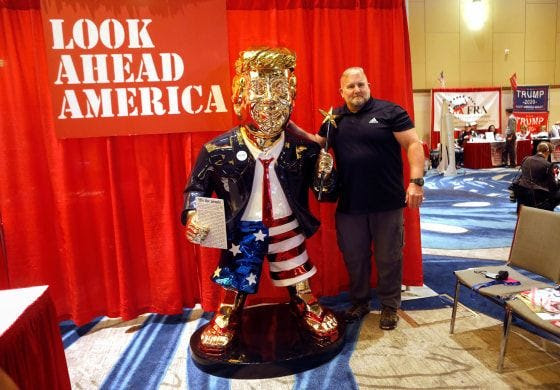 Image: gold statue of former President Donald Trump at CPAC