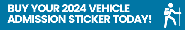 A blue button with text that says "BUY YOUR 2024 VEHICLE ADMISSION STICKER TODAY!" and an image of a hiker.