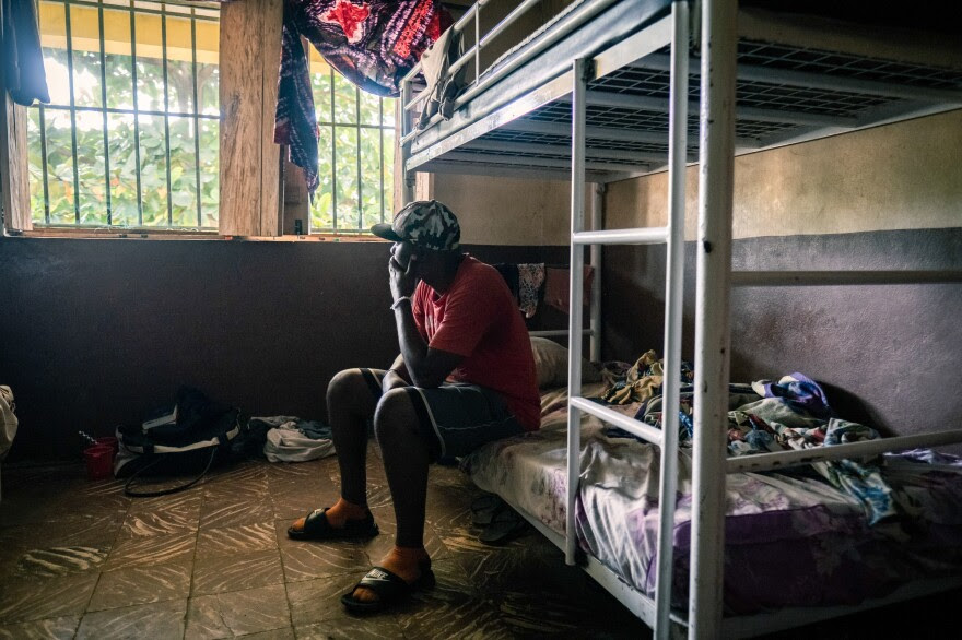Kush user Ahmed Kang, 30, sits on his bunk at the City of Rest rehabilitation center in Grafton, Sierra Leone. Kang, who is on his third stint at the facility, says it took ten police officers to drag him inside. "It's so addictive," says Kang. "And it costs less than a pack of chewing gum. How can you even control that?"