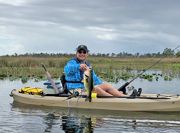 Angler with braid-caught bass
