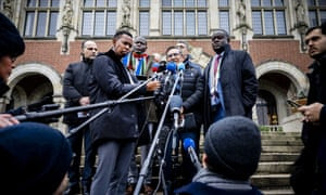 The South African delegation speaks to the press in front of the international court of justice after the second day of the hearing of the genocide case against Israel in The Hague (Photo:EPA/Remko  De Waal)