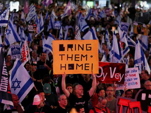 People attend a protest against Israeli Prime Minister Benjamin Netanyahu's government and to call for the release of hostages in Tel Aviv, Saturday.
