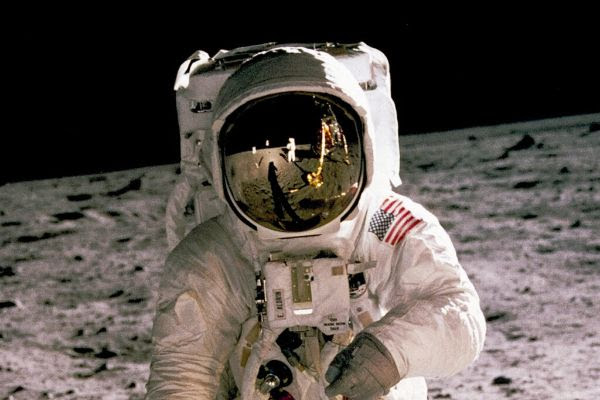 An astronaut in a space suit on the moon.