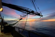 Crane on top of a shrimp trawl.