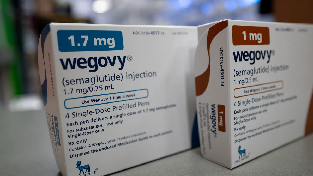 Two prescription drug cartons stand side by side on a counter, each bearing the word Wegovy.