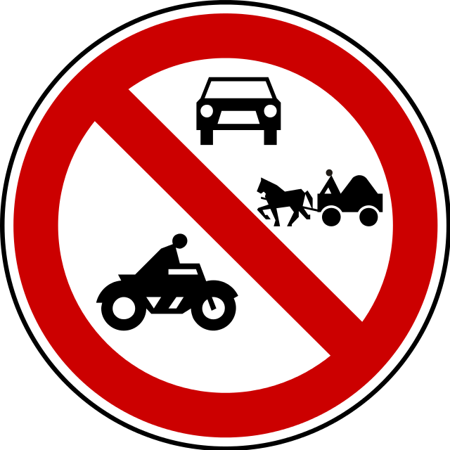 A picture containing wheel, traffic sign, signDescription automatically generated