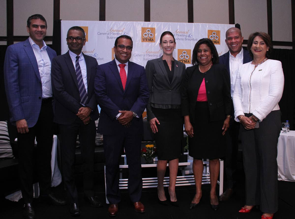 Minister of Trade and Industry Paula Gopee-Scoon, third from right, with, from left, Nicholas Lok Jack, executive director, Asscoiated Brands Industries Ltd; Richard Seeteram, head of Supply and Chain for the Anglo-Dutch Caribbean, Nestle; Joel Pemberton, CEO, DeNovo Energy Ltd; newly elected president of the TT Manufacturers' Association (TTMA) Franka Costelloe; Gregory Hannays, partner, Ernst and Young; and Karen Darbasie, group CEO First Citizens Bank at TTMA's AGM Business Breakfast meeting yesterday, at the Hilton Trinidad and Conference Centre, Port-of-Spain.