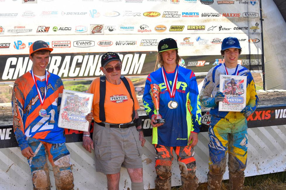 John Penton pictured with the youth overall podium: Zack Davidson, Peyton Whipkey and Mack Riemer.
